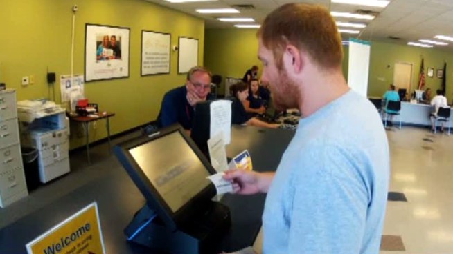 DPS plans to implement touch-screen check-in at its license offices, but the commissioners that oversee the agency raised questions about company the agency wants to hire.
