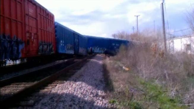 A man who was getting his oil changed when a train derailed in Arlington saw train cars ping-pong into each other before six cars lifted off the tracks.