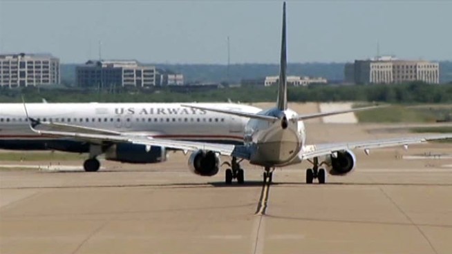 Three American Airlines unions reach agreements should the airline merge with US Airways, although American says it remains focused on its plan to emerge from bankruptcy on its own.