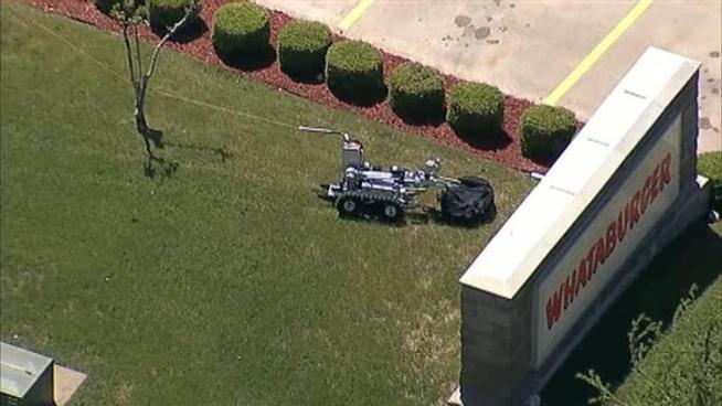 A suspicious package in front of a Whataburger is detonated by Plano police.