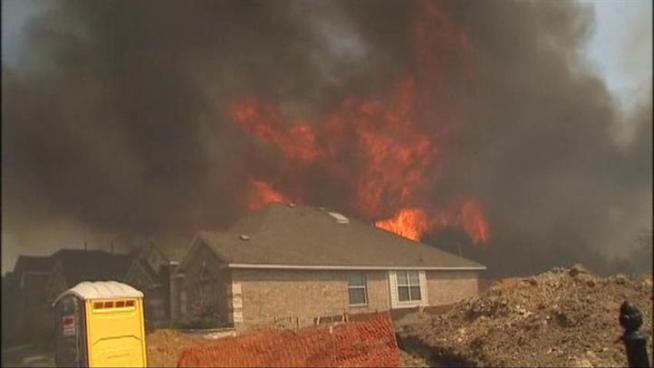 Large wildfires on the border of Ellis and Dallas Counties forced residents from their homes on Saturday.