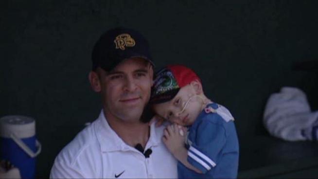 In a baseball double header, Dallas firefighters and some of New York's finest raised money for a young boy diagnosed with liver cancer.