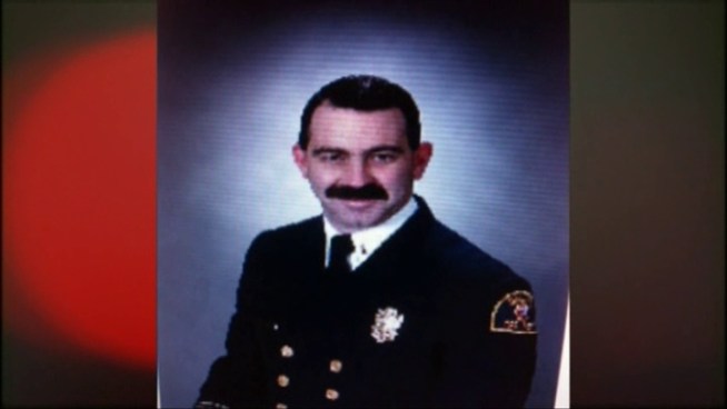 A veteran Dallas firefighter was killed after falling through the roof of a burning apartment building.