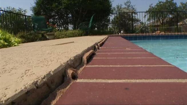 The drought is causing dry soil to move and crack pipes -- a big problem for pool owners.