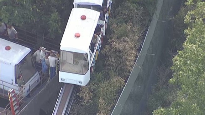 Passengers aboard a monorail through a Dallas Zoo exhibit were trapped after an electrical short.