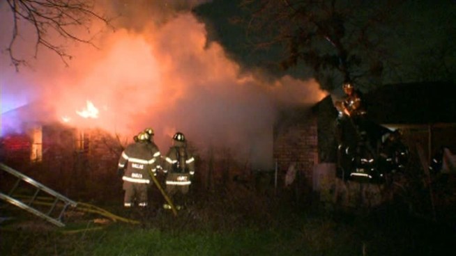 A West Dallas man is clinging to life after being trapped in his home during an overnight fire.