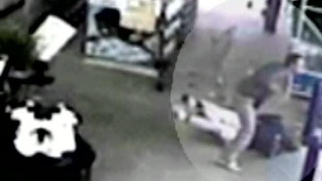 Surveillance video shows a shoplifter pushing a Walmart greeter who confronted him when he tried to walk out with a television without paying.