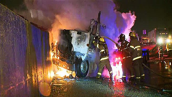 An 18-wheeler crashed into a guardrail on Interstate 30 causing lane closures in Dallas Wednesday morning.