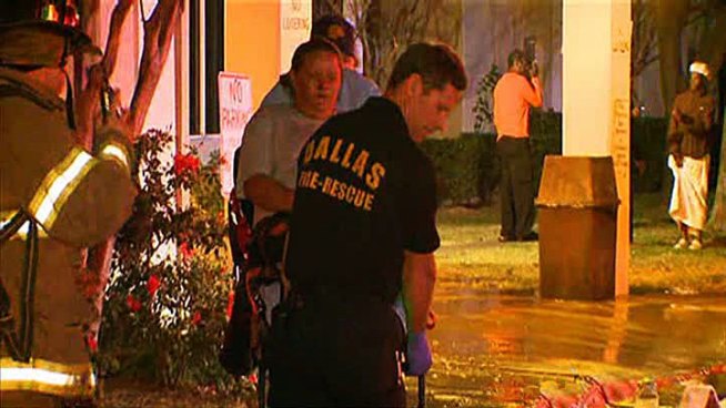 A woman in east Dallas was taken to the hospital Friday morning after she reportedly woke up to find her bed on fire.