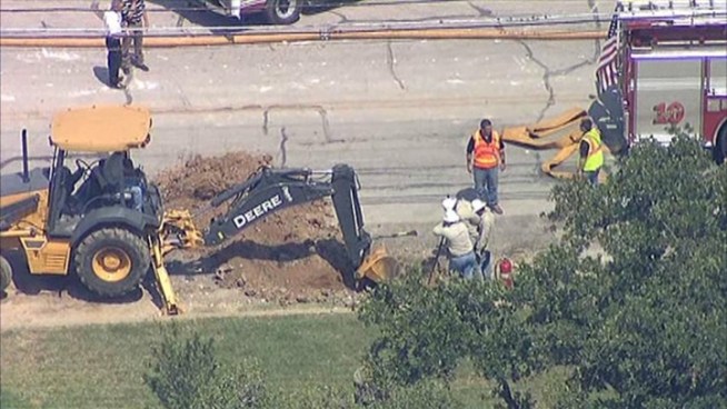 Firefighters are working to get a gas line explosion under control in Lake Worth after a backhoe hit a three inch residential line.