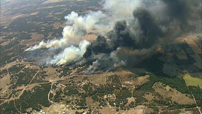 Fire crews say a brush fire that burned 500 acres southwest of Bridgeport between Paradise and Runaway Bay is under control.