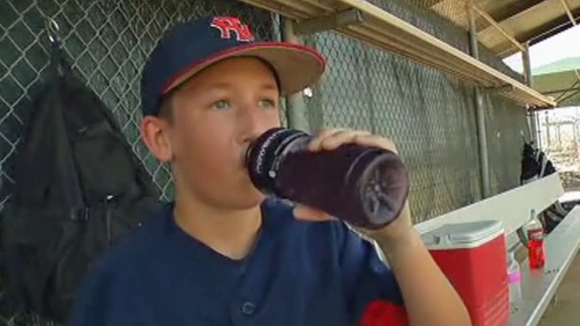 Hundreds of youth baseball players in Flower Mound are working hard not to overheat during one of the largest baseball tournaments in the country.