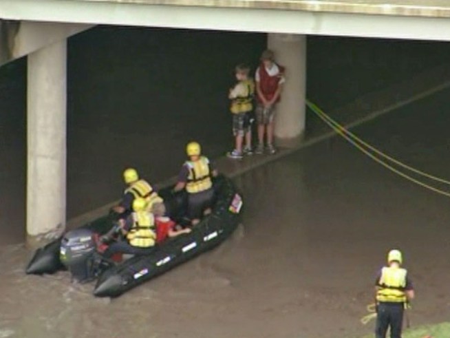 Emergency crews rescued three children stuck in the middle of White Rock Creek in <a title=