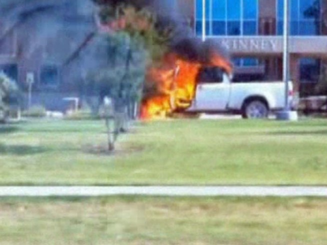 A Ford pickup truck with a trailer pulled up to the municipal building just after 9 a.m. and was soon after engulfed in flames. <a title=