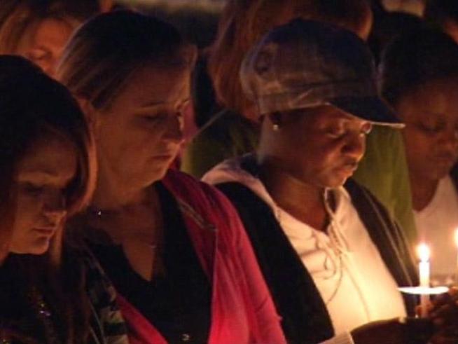 More than a hundred people gathered at the scene of a double shooting-suicide in <a title=