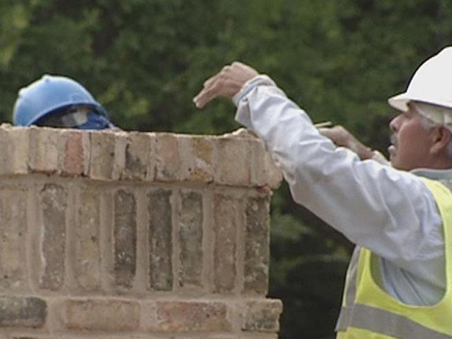 Construction is underway on a gate leading to Daria Place - the street where former President George W. Bush and the former first lady live in Dallas.
