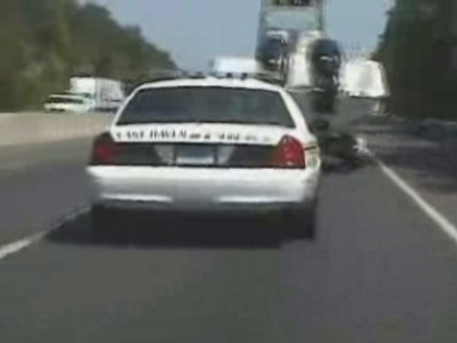 Dash-cam video from the Branford PD shows a man swerving on I-95 while towing a stolen boat, ultimately crashing the boat on the highway and landing himself behind bars.