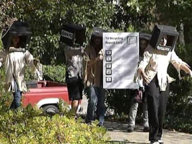 People dressed as old televisions walked the streets of Dallas Monday to highlight the importance of TV recycling.
