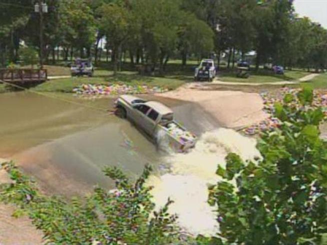 A greenskeeper at Diamond Oaks Country Club was attempting to cross a spillway on the golf course when his truck got stuck in a fast-moving current.