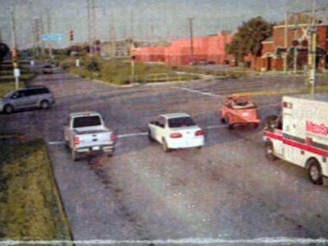 A pastor yields the right of way to an ambulance and is ticketed by a red light camera.