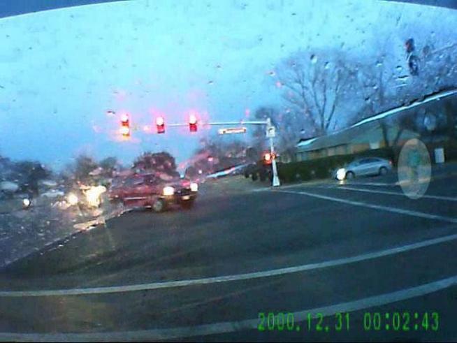 CAUTION: PROFANITY: A witness' camera records a pedestrian hit by a car while crossing an intersection.