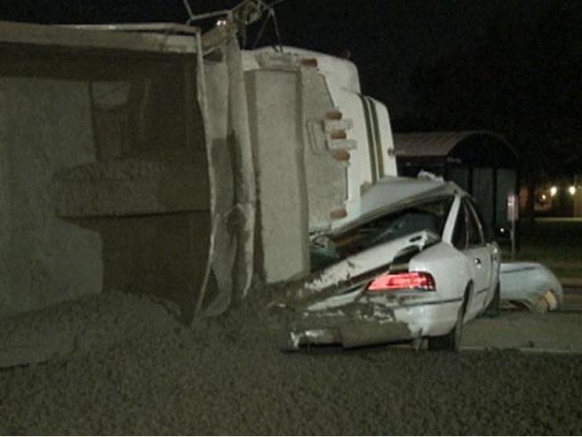 A car and dump truck carrying wet concrete colliding leaving a mess at the intersection of Hampton Rd. and Bickers St. in Dallas.