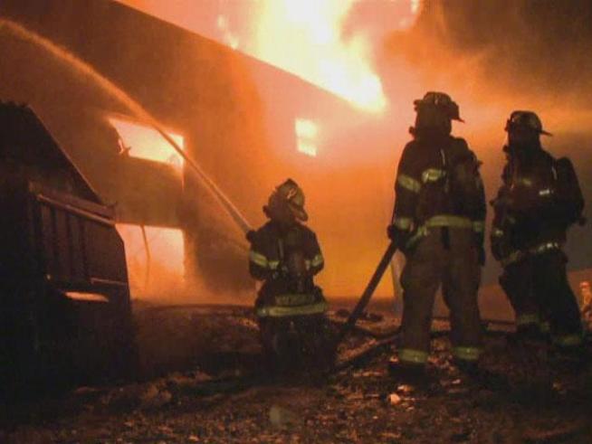 A warehouse was destroyed early Monday by a four-alarm fire.