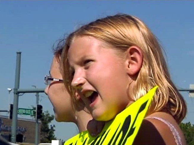 A 10-year-old girl is trying to help her parents buy a new air conditioner. She and a friend are selling lemonade and fruit punch at the corner of West Bedford Road and Norwood Drive in <a title=