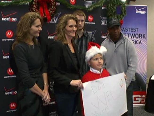 Former Cowboys record Christmas messages with soldiers' families.