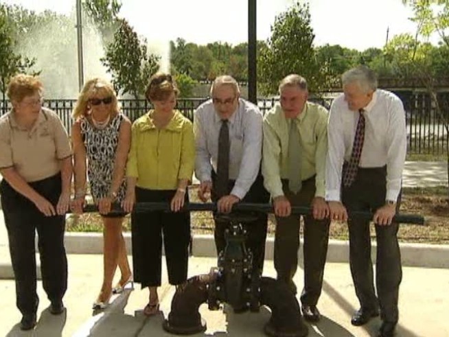 Assembled dignitaries? Check. Platitude-laden speeches? Check. Fake giant water valve? Wait, what?