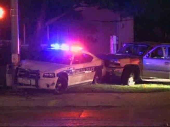 A driver tailing police pushes the police car across six lanes into a pole.