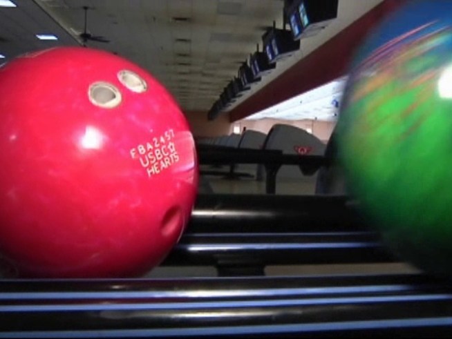 Bowling ball in hand, a <a title=
