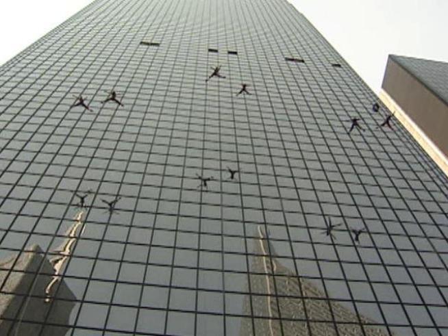 Dancers from Project Bandaloop perform 21 stories in the air on the side of Thanksgiving Tower in <a title=