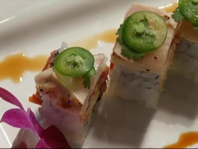 Nosh on Dragon Ballz and watch Godzilla kick Mothra's butt at Blue Sushi Sake Grill in <a title=
