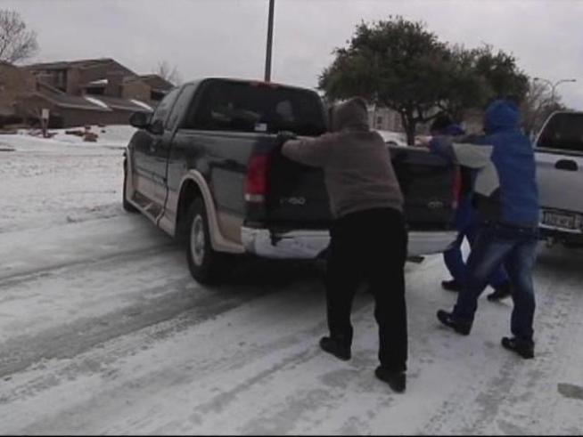 Drivers help each other through slick spots on some <a title=