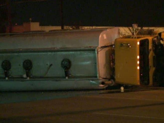 A tanker truck slips on ice and overturns along Singleton in <a title=