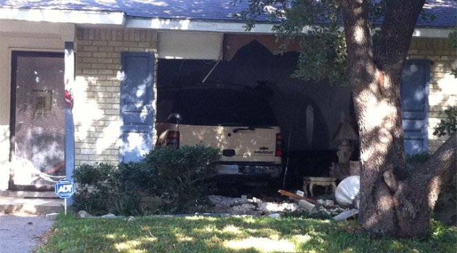 DeSoto police say a man drove his Chevy Tahoe SUV into his house, then got out and stabbed a woman who lived with him.