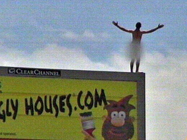Naked man paces atop billboard for almost 4 hours