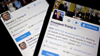 The Twitter Inc. accounts of U.S. President Donald Trump, @POTUS and @realDoanldTrump, are seen on an Apple Inc. iPhone arranged for a photograph in Washington, D.C., U.S., on Friday, Jan. 27, 2017. Mexican President Enrique Pena Nieto canceled a visit to the White House planned for next week after Trump on Thursday reinforced his demand, via Twitter, that Mexico pay for a barrier along the U.S. southern border to stem illegal immigration.