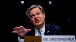 FILE - FBI Director Christopher Wray testifies before a Senate Homeland Security Committee hearing on Capitol Hill in Washington, Tuesday, Nov. 5, 2019.