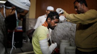 A man receiveds medical treatment at an Indian hospital
