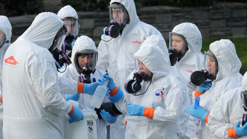 A disaster recovery team prepares to enter a nursing home infected with coronavirus patients