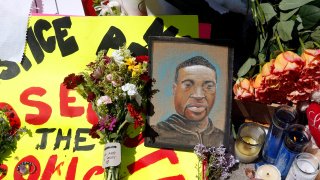 In this May 27, 2020, file photo, a chain portrait of George Floyd is part of the memorial for him near the site of the fatal arrest of Floyd.
