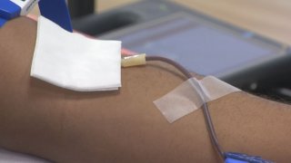 A person donates blood.