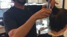 Supercuts stylist Chris Sanchez in Plano says clients are embracing longer locks and the grey that came under stay-at-home orders.