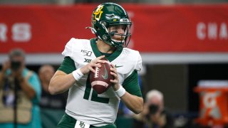 Charlie Brewer #12 of the Baylor Bears looks to throw against the Oklahoma Sooners in the first half of the Big 12 Football Championship at AT&T Stadium on Dec. 7, 2019 in Arlington, Texas.