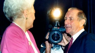 FILE - in this Oct. 1990 file photo, Texas Democratic gubernatorial candidate, Ann Richards, offers her hand to Republican candidate Clayton Williams in Dallas. Williams, a colorful Texas oilman whose 1990 run for governor was derailed by making a joke about rape and saying he didn't pay income taxes one year, has died. He was 88. A relative says Williams died Friday, Feb. 14, 2020, at his home in Midland, Texas, after struggling with pneumonia.