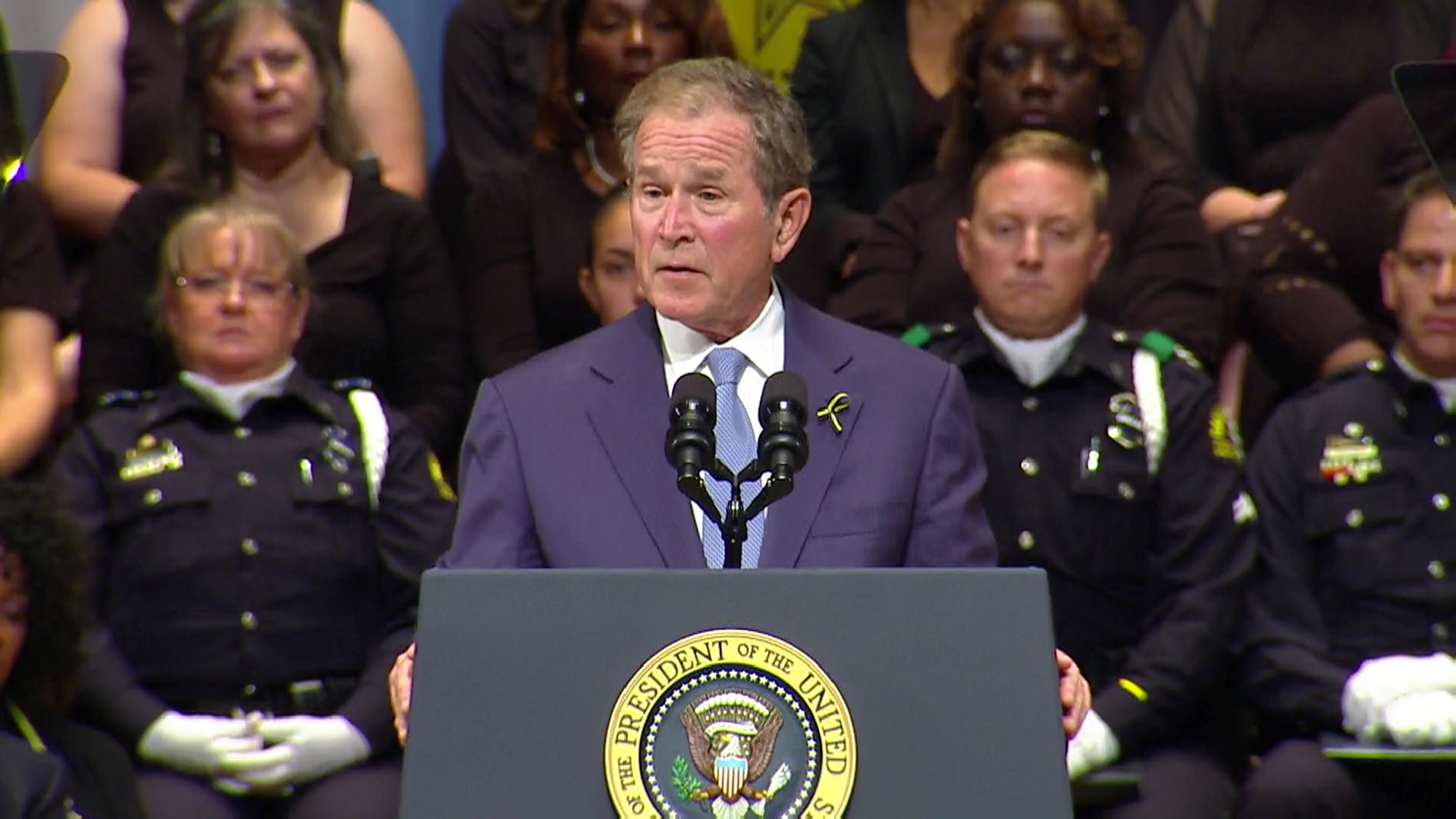 Former president George W. Bush speaks at the interfaith tribute.
