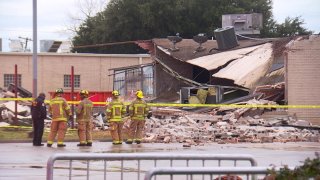 A building collapsed in the 7100 block of John W. Carpenter Freeway in Dallas, Texas on Saturday, Dec. 28, 2019.