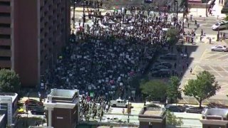 Protesters march through downtown Dallas on Saturday, May 30, 2020.